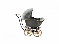 Side angled view showing the woven wicker body and hood, metal frame with wooden wheels.