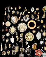 Full overhead view of all charms and pendants arranged on black cloth background showing various colors, shapes, and sizes including wood, metal, stone, and enamel pieces.