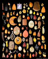 Full overview of all charms and pendants laid out on black background