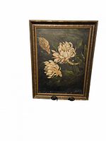 Full frontal view of painting and frame on easel stand