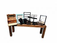 Photo showing entire collection of jewelry display fixtures arranged on wooden table including jewelry box, velvet busts, earring displays, bracelet and ring stands, multi-tier tray stand, and necklace stands.