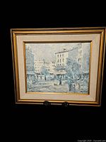 Full view front of Paris city street scene oil painting with ornate gold frame, showing overall condition and framing style