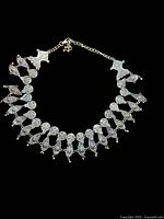 Full view of the vintage silver belt showing linked decorative pieces and adjustable chain closure.