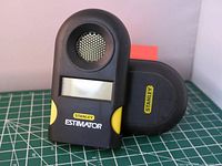 Photo of Stanley 39-030 ultrasonic room size estimator tool showing front display and speaker grill with Stanley brand markings.