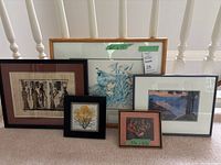 All five framed artworks standing together