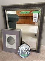 Mirror, print and plate grouped together for scale