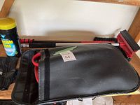 Shelf with booster cable pouch, snow brush, Invisible Glass cleaner