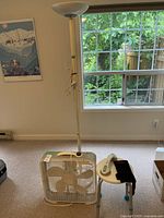 Overall view showing lamp, fan and stool