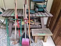 Overall view of potting table, bench, long-handled tools and hand tools