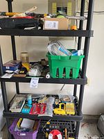 Wide view of shelving with assorted tools and supplies
