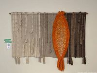 Full view of woven wall hanging on wall
