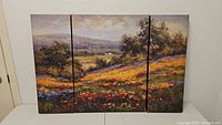 Frontal view of the three-piece canvas art set arranged side by side showing the full landscape scene.