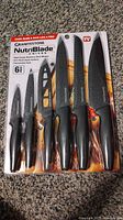 Front view of the sealed 6-piece GraniteStone NutriBlade knife set showing all knives in package.