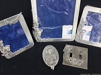 Set of 3 pewter photo frames in brand new condition with Anne of Green Gables motifs on black background.