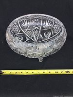 Side angle showing starburst pattern, three feet, and 12 inch diameter measurement with tape measure included