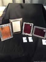 Four Blue Mist pewter photo frames against black backdrop, showing different border designs and card placeholders