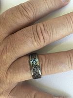 Men’s tungsten carbide ring size 12 with detailed black Celtic pattern on hand.