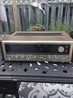 Front and top view showing wood-finish cabinet, front panel and tuning window