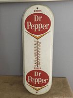 Front view showing full sign graphics and thermometer