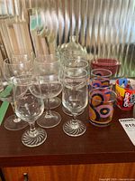 Group view of stemware and printed tumblers on tabletop