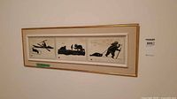 Full view of framed triptych Inuit print on wall