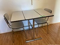 Table and two chairs overall view