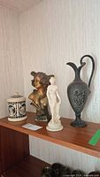 Shelf view showing all four decorative items