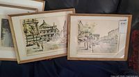 Both framed prints side by side showing subjects and frames