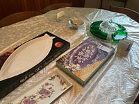 Overall view of platters, bowls, crudité tray, boxed items on table