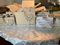 Overview of boxed Rosenthal stemware on table with two sample glasses displayed