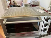 Front and top view of stainless steel Cuisinart toaster oven on countertop