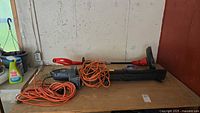 Both tools and cord on workbench