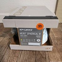 Photo of the unopened box showing the Giro Merit Spherical adult small helmet size and packaging details.