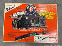 Box showing original packaging artwork and Lionel branding for New York Central Flyer O-27 scale train set with features.
