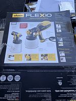 Box showing product name, model FLEXiO 3000, and product features including spray control and cleanup.
