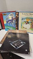 Photo of assorted 70s vinyl records showing covers of Supertramp, Cat Stevens, and others arranged upright and face forward.