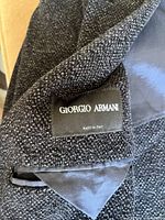 Close-up of Giorgio Armani brand label sewn inside jacket.
