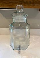 Full view of glass beverage dispenser with lid attached