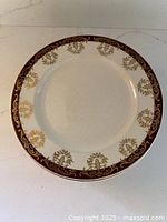 Top view of one Alfred Meakin Rideau dessert plate showing burgundy and gold border
