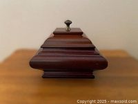 Front profile of mahogany musical ring box