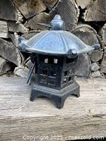 Front view of cast iron pagoda candle holder