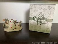 Front view of figurine and box