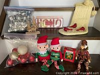 Full lot showing ornaments, plush elves, stocking, wooden deer scene, banner, star ornament box, red cardinals