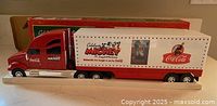 Full view of truck model on display base with trailer graphics visible