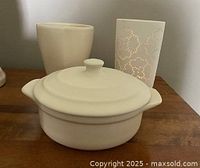 All three cream ceramic pieces grouped