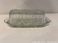 clear pressed-glass butter dish side view