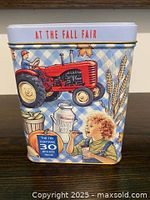 Front view showing tractor illustration and At The Fall Fair text