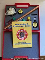 Open kit displaying all components and booklet