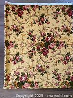 Full view of folded yellow floral fabric piece