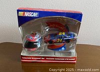 Front view of sealed Jeff Gordon ornament set showing car and helmet ornaments in packaging
